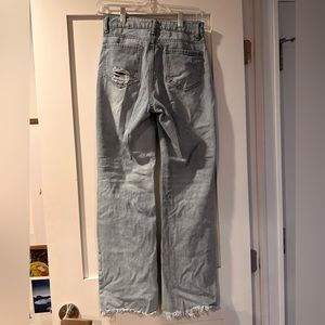 Gianni Bernini blue jeans with knee rips/ holes